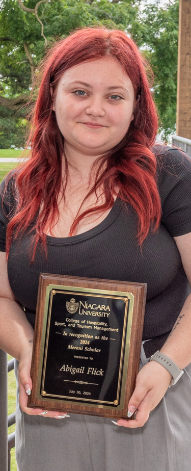 Photo of Abigail Flick with the award