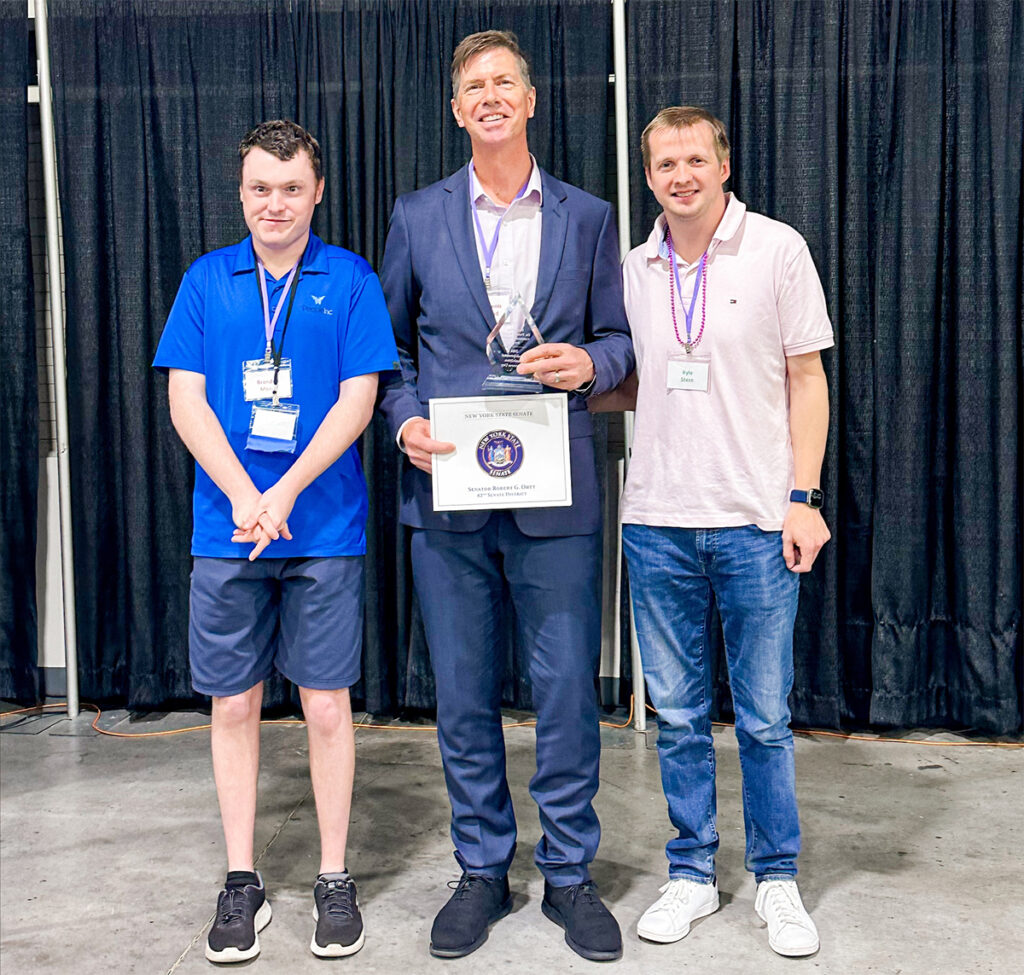 Dr. Dennis Garland with Special Olympic athletes Brandon and Kyle.