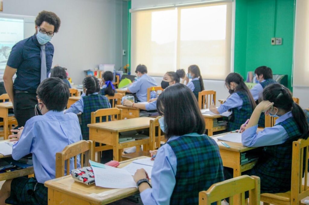 Eddie McBride, ’17, M.S.Ed.’18, with his students at Lertlah School in Bangkok, Thailand