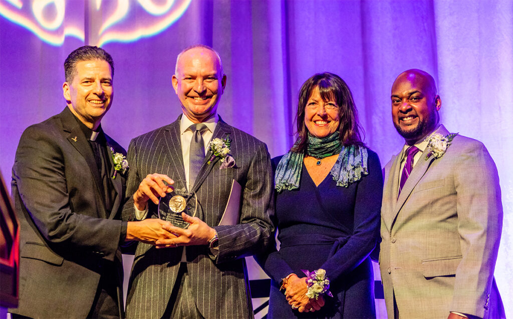 Dr. C. Henrik Borgstrom and Donna L. DeCarolis received the Ozanam Medal at Niagara University's 2024 President's Dinner Oct. 29, 2024. They are pictured with the Rev. James J. Maher, C.M., president of Niagara University, and Rev. Craig Pridgen, NU trustee.