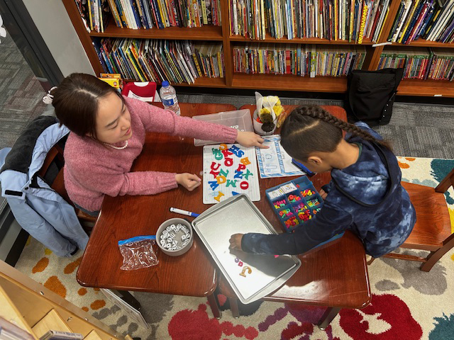 Family Literacy Center, working with student
