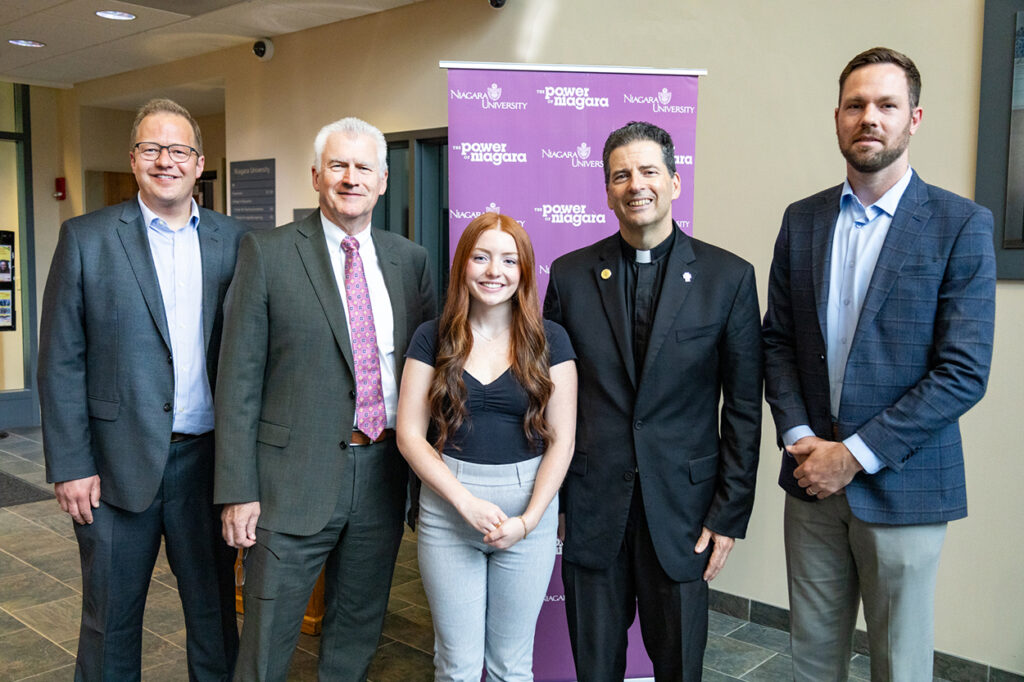 Dr. Petter Lovaas, Niagara University’s chief information security officer and chair of the Department of Cyber Security & Operations; Dr. Timothy Ireland, provost and vice president of Academic Affairs; Samantha DalPorto, field representative for Congressman Timothy M. Kennedy; Rev. James J. Maher, C.M., president of Niagara University; and George McNerney, regional director for Congresswoman Claudia Tenney, at the announcement of Niagara University’s designation as a National Security Agency Center of Academic Excellence in Cyber Defense.
