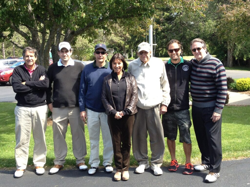 Paul Yesawich Jr. (third from right) with son Paul Yesawich III; grandson John Yesawich; son Christopher Yesawich; daughter-in-law Paris Pyne Yesawich; grandson Peter Yesawich Jr.; and son Peter Yesawich at a family golf outing in 2015.
