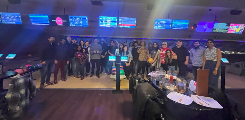 Graduate students at Niagara University in Ontario celebrate the end of the semester with a glow bowling party, just one of the events hosted by Student Services to help students feel a sense of belonging and community.