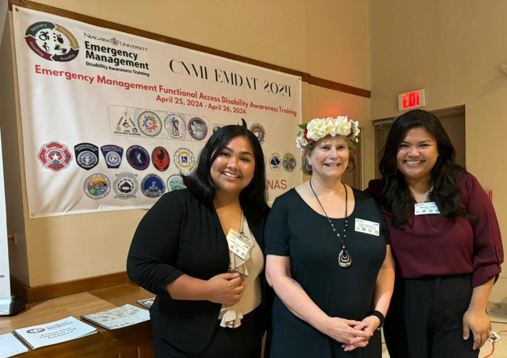 Niagara University emergency management master trainer Vicky Davidson (center), with Red Cross personnel from the Commonwealth of Northern Mariana Island. Davidson presented the training to an audience of 100 people across many disciplines.