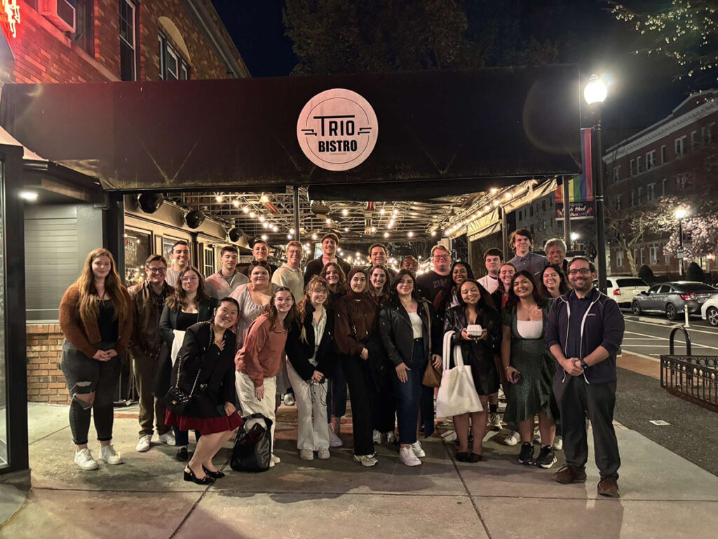 students enjoyed a dinner with alumni Emily Leffler, Jacob Tucker, and Theo Marcucci at Trio Bistro