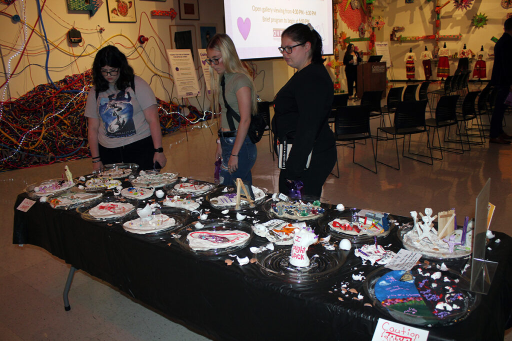 The display “Walking on Egg Shells,” created with clay and found objects, shed light on the discomfort and cycle of abuse.