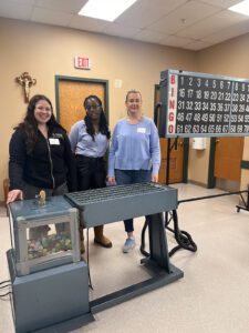 Three students in a BINGO hall.