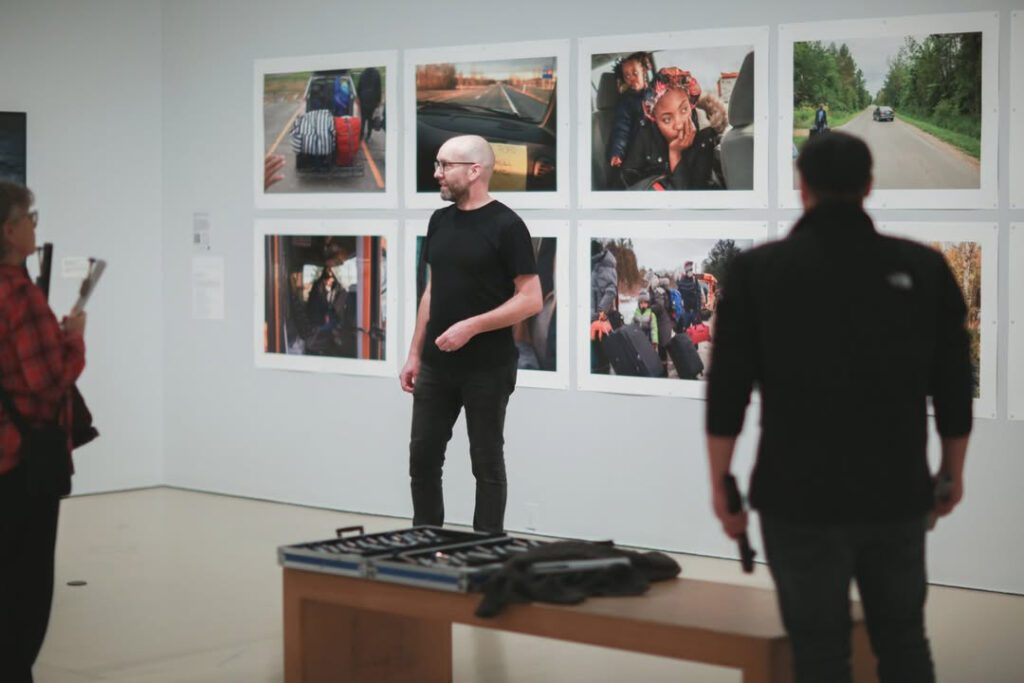 Dr. Doug Tewksbury in art gallery leading sound exhibition
