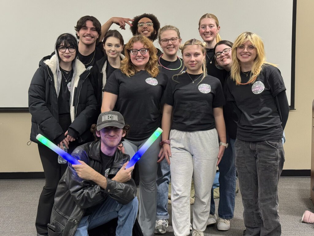 Eleven college students standing in a group