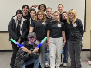 Eleven college students standing in a group