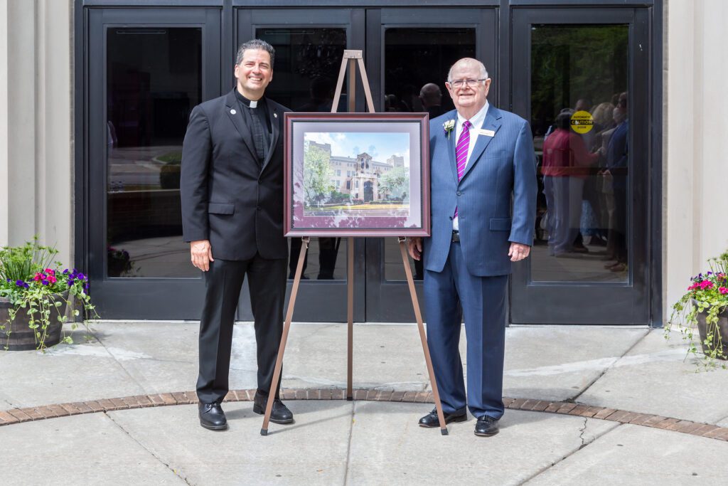 President of Niagara University with James Glynn in front of artist's rendering of new Glynn Hall on campus.