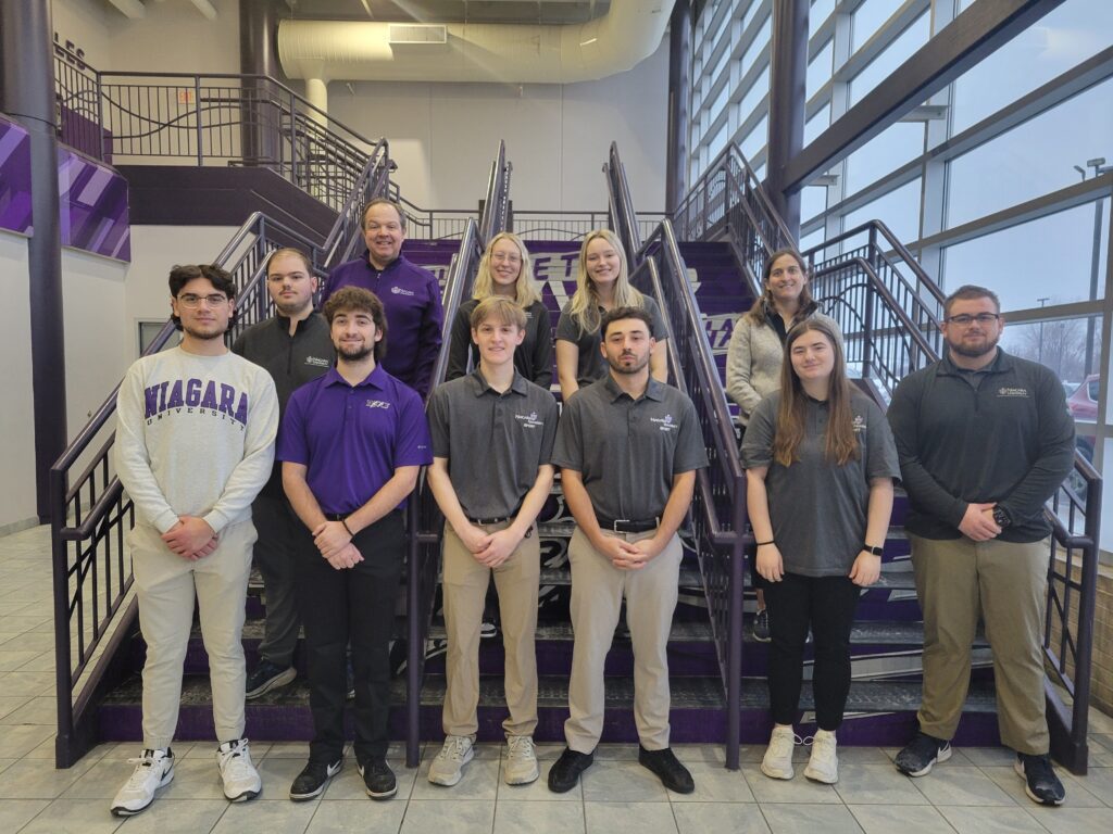 Group photo of the Niagara University group that is participating in Super Bowl events.