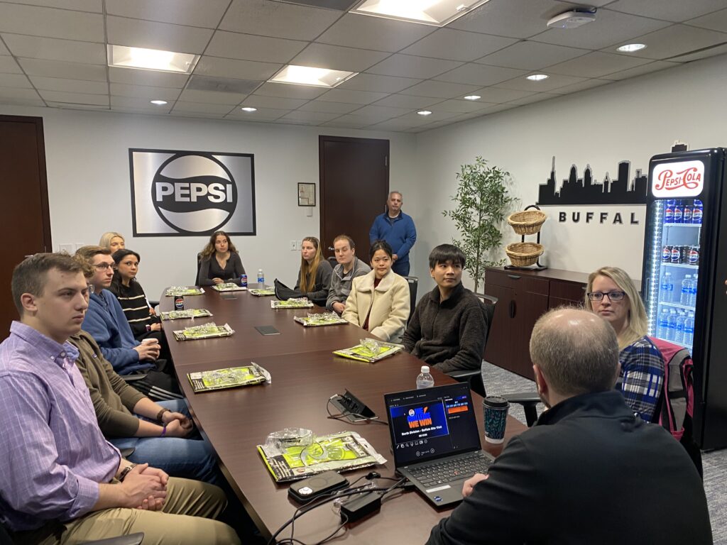 Students in the Pepsico warehouse conference room.
