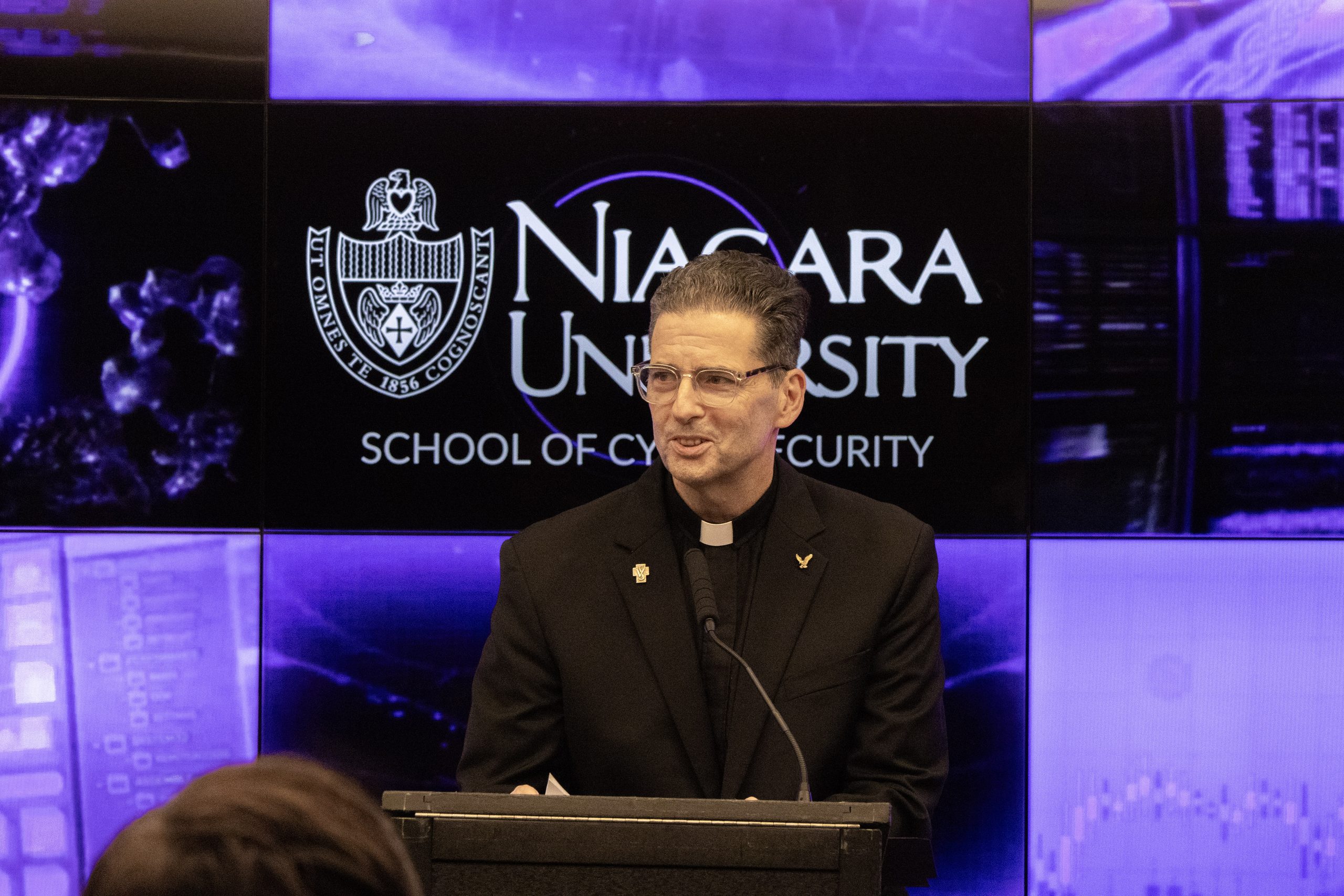 Father Maher giving his speech during the press conference.