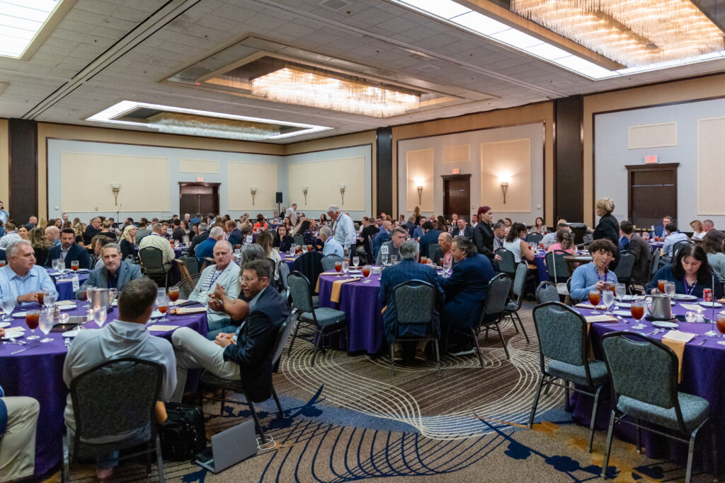 A group of people gathering at the Hyatt Regency for the Food Summit.
